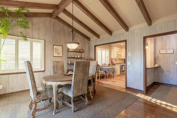 a view of a dining room with furniture and a table