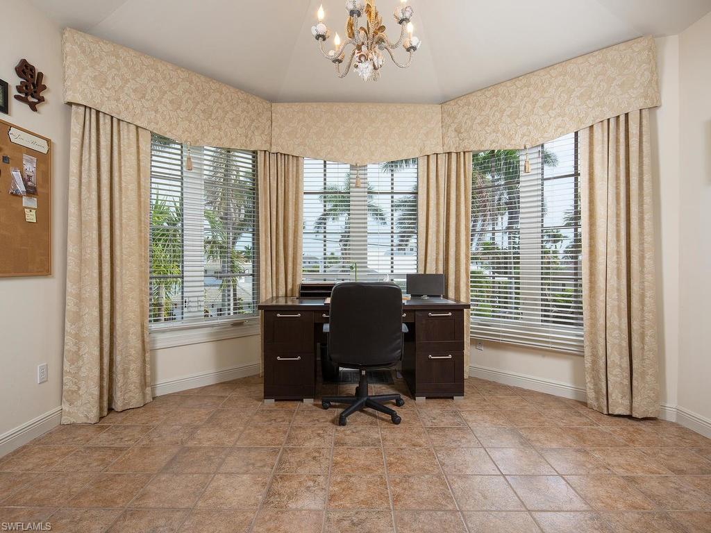 720 17th Avenue South Naples, FL 34102 - Photo 18 of 33 a view of a livingroom with workspace and a window