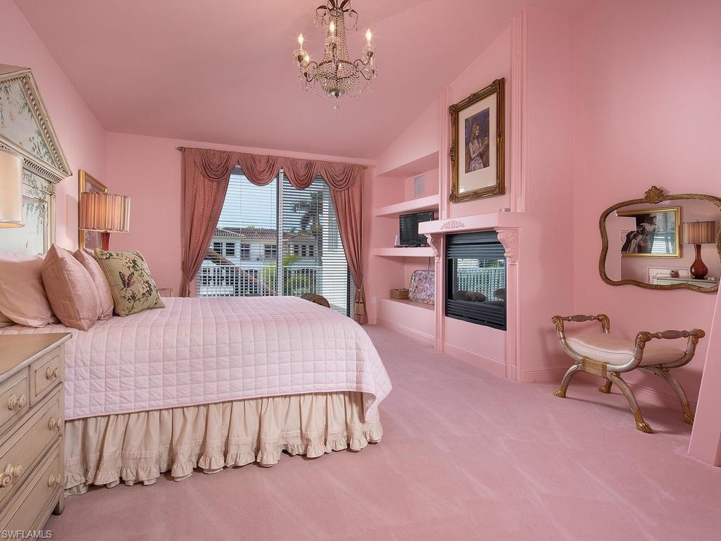 720 17th Avenue South Naples, FL 34102 - Photo 19 of 33 a bed room with a bed and a chair