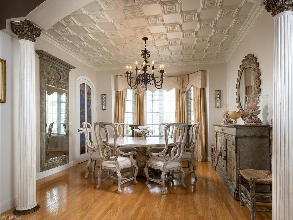 720 17th Avenue South Naples, FL 34102 - Photo 2 of 33 a view of a dining room with furniture and wooden floor