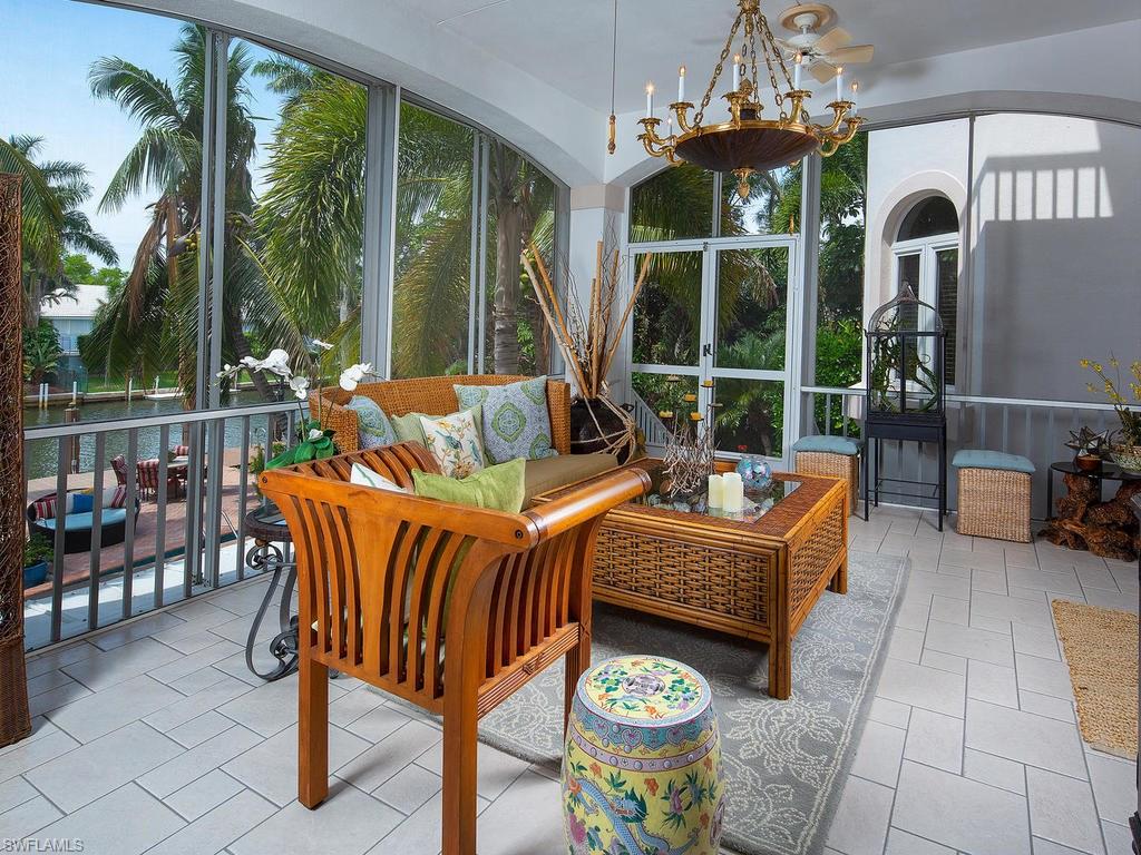 720 17th Avenue South Naples, FL 34102 - Photo 23 of 33 a outdoor living space with furniture and garden view