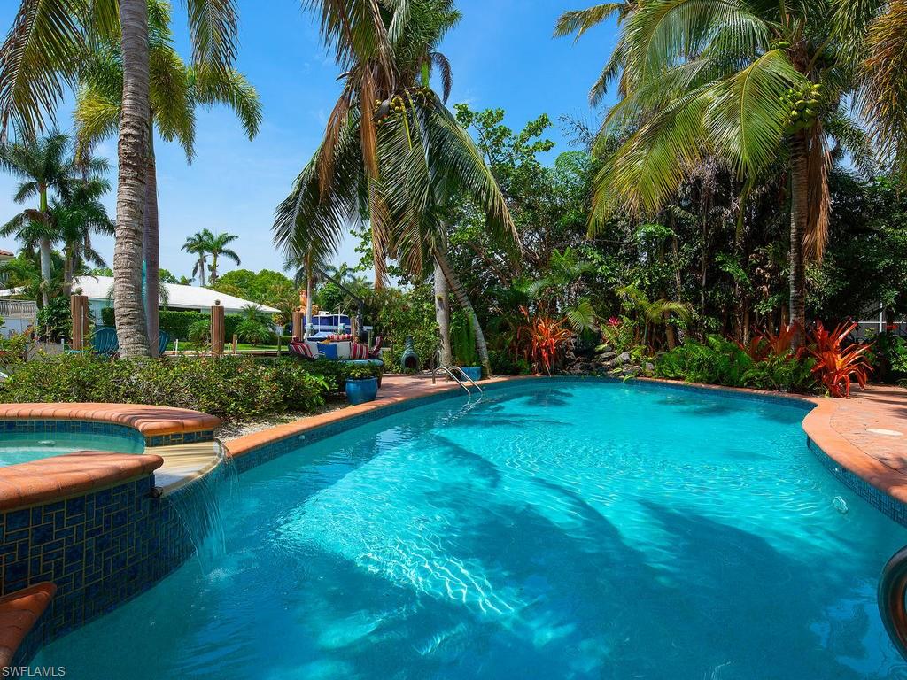 720 17th Avenue South Naples, FL 34102 - Photo 26 of 33 a view of a garden with palm trees