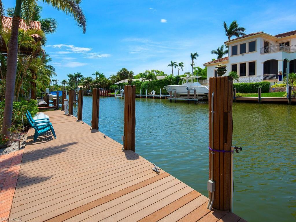 720 17th Avenue South Naples, FL 34102 - Photo 31 of 33 a view of a lake with boats and palm trees