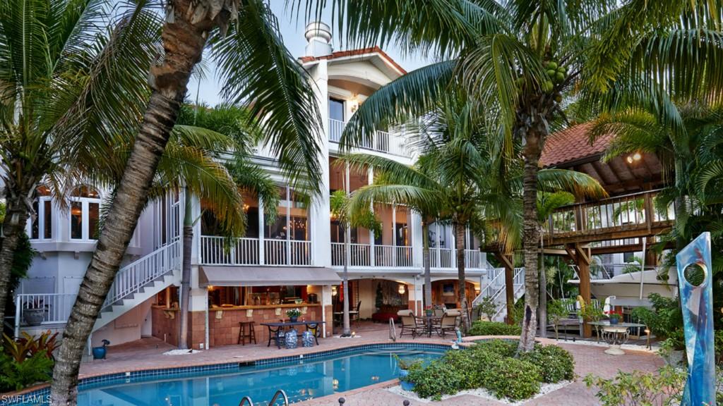 720 17th Avenue South Naples, FL 34102 - Photo 33 of 33 a view of swimming pool with palm trees