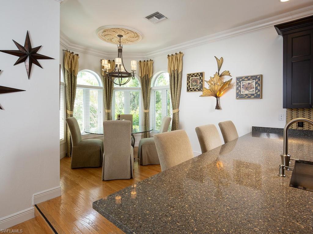 720 17th Avenue South Naples, FL 34102 - Photo 8 of 33 a living room with furniture and a window
