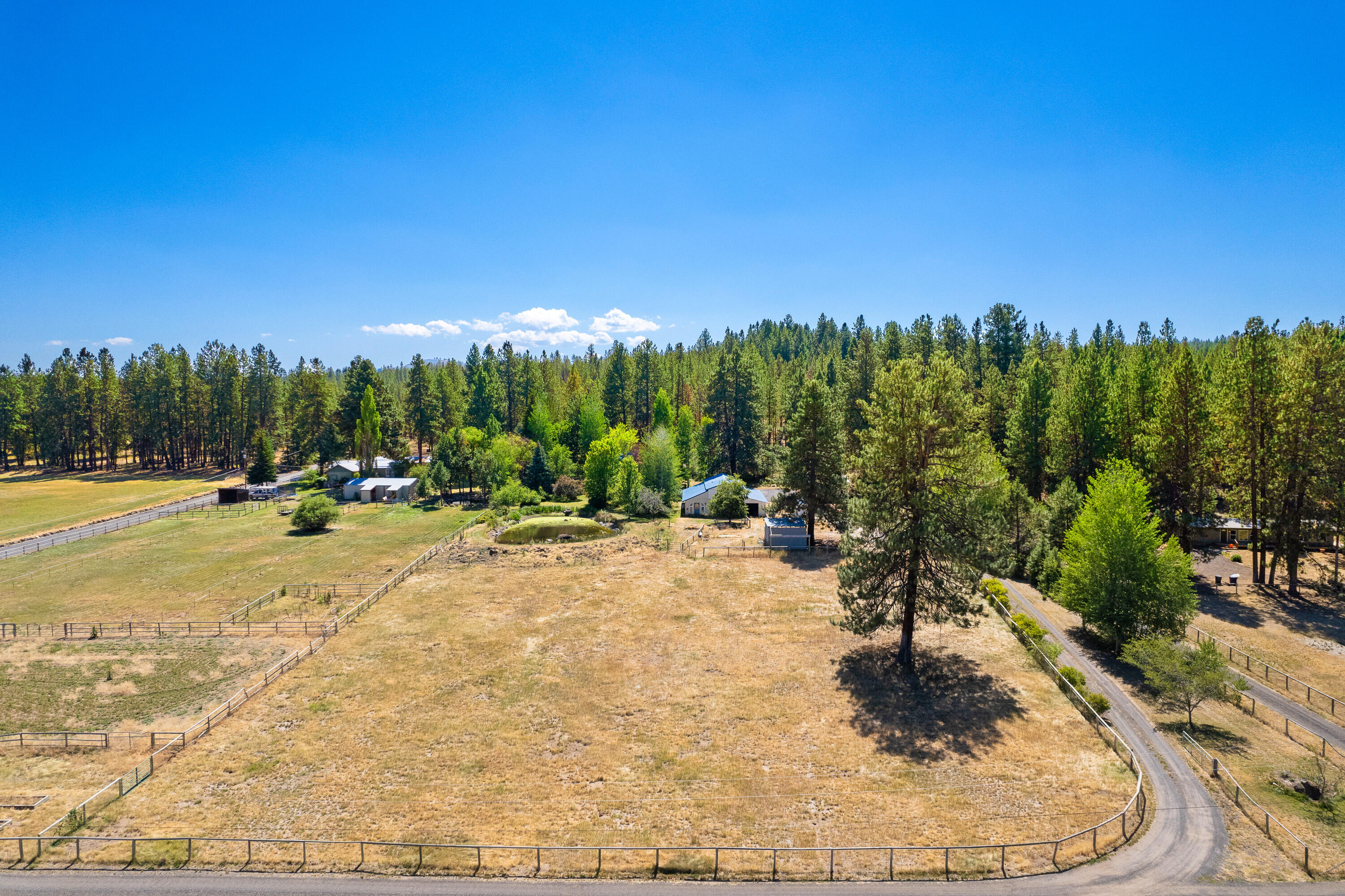 60297 Tekampe Road Bend, OR 97702 - Photo 1 of 33 a view of swimming pool and trees in the background