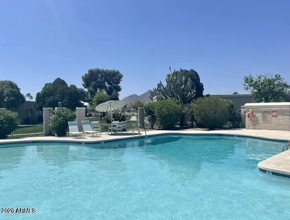 a view of backyard of house and trees