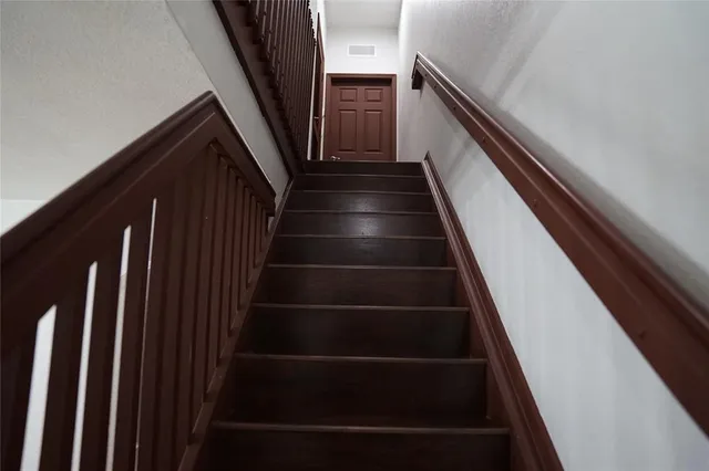a view of living room with furniture and a potted plant