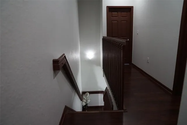 a bedroom with a bed chair and a window