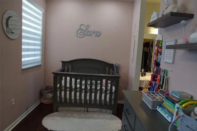 a bedroom with a bed and window