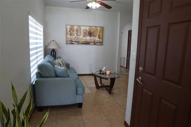a living room with furniture and a window