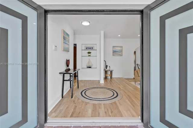 a living room with furniture and a lamp