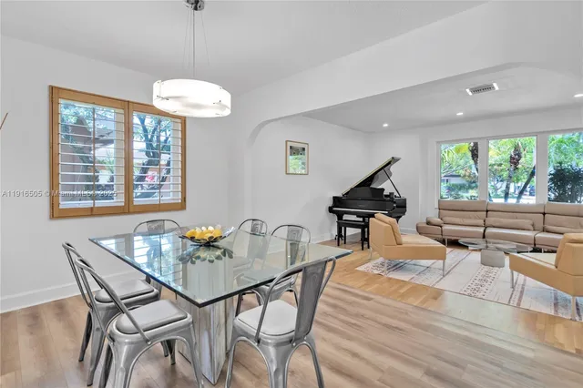 a kitchen with stainless steel appliances granite countertop a refrigerator and a stove