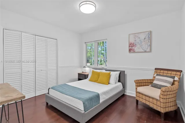 a bedroom with a bed and a cabinets