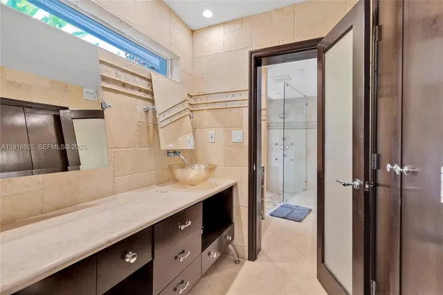 a view of storage and utility room with washer and dryer