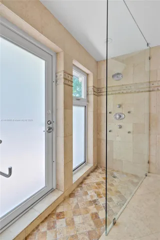 a bathroom with a sink and shower