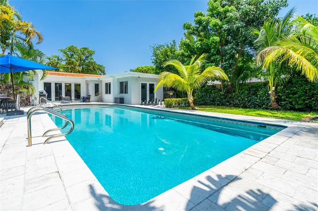 a view of a house with swimming pool
