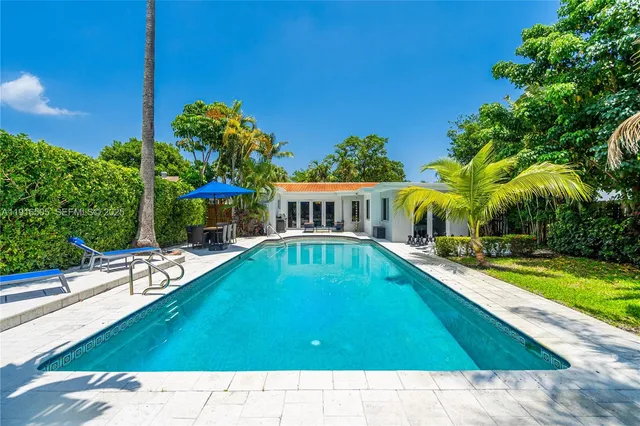 a view of swimming pool with lounge chair
