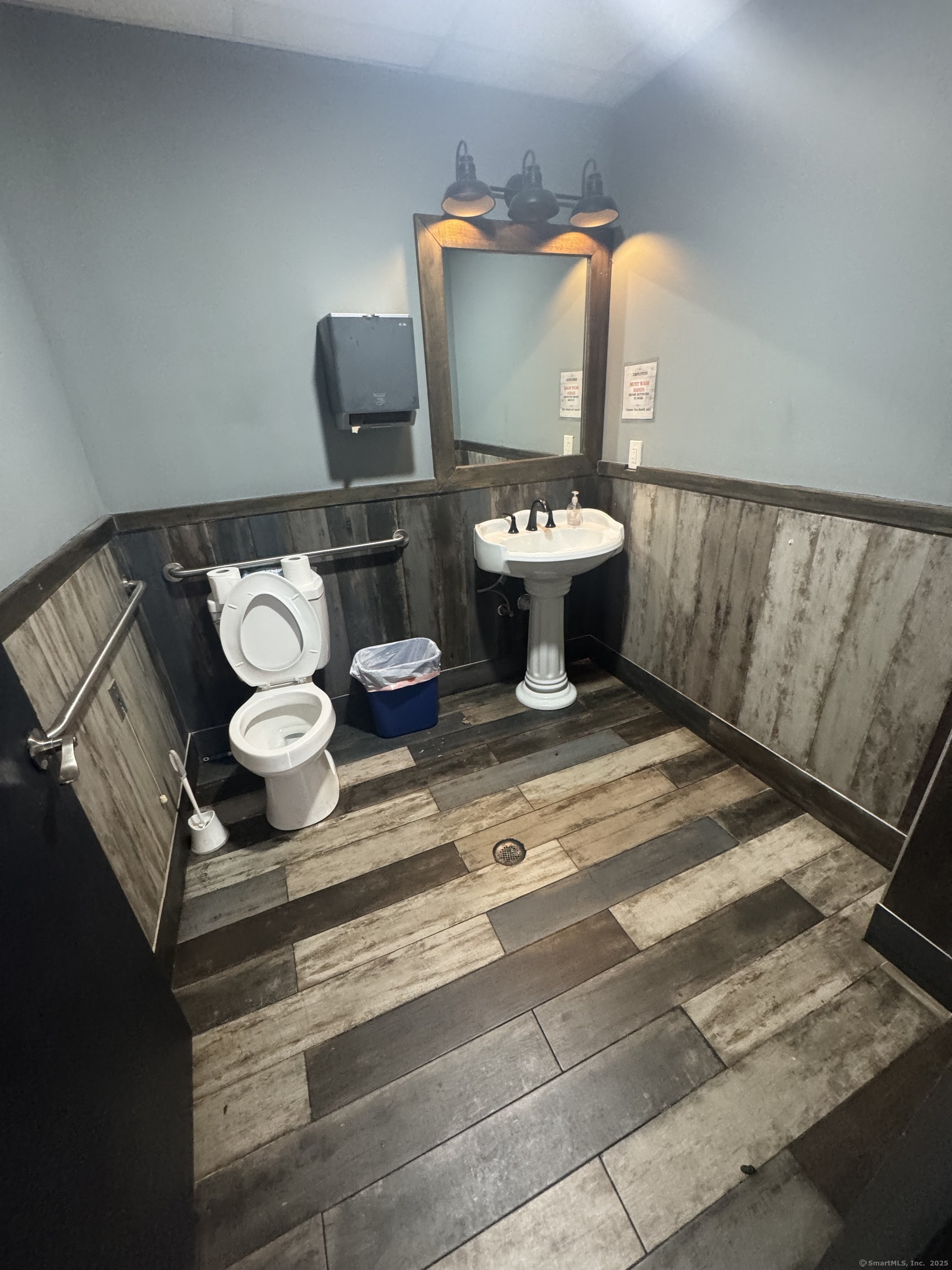 Undisclosed Address Bridgeport, CT 06607 - Photo 13 of 36 a bathroom with a sink toilet and mirror