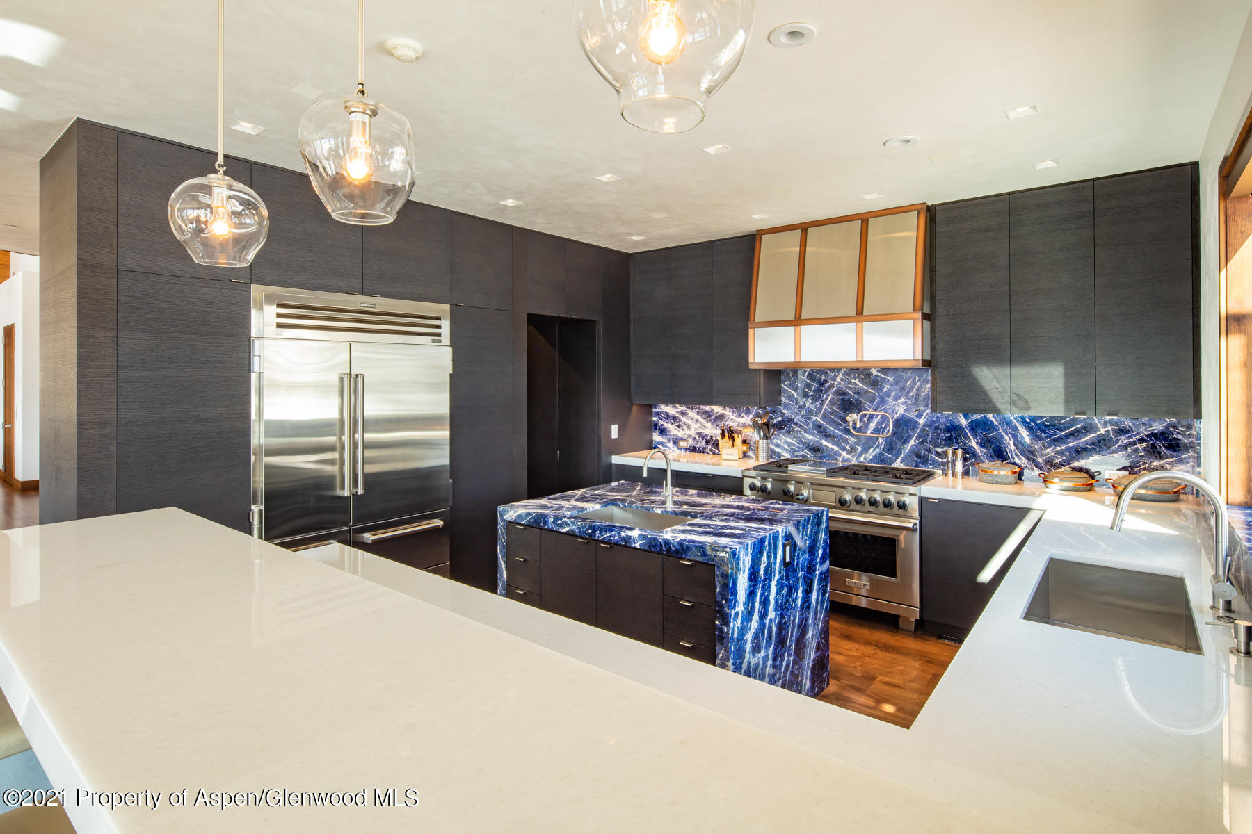 70 Larson Road Aspen, CO 81612 - Photo 17 of 64 a kitchen with stainless steel appliances granite countertop a sink stove and refrigerator