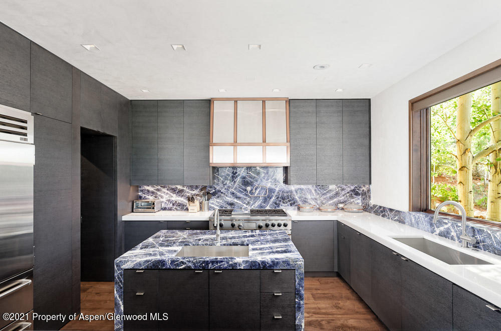 70 Larson Road Aspen, CO 81612 - Photo 20 of 64 a kitchen with a granite counter tops a window and a sink