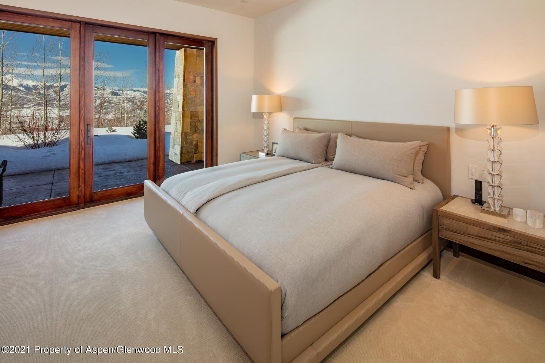 70 Larson Road Aspen, CO 81612 - Photo 29 of 64 a bed room with a bed and a night stand