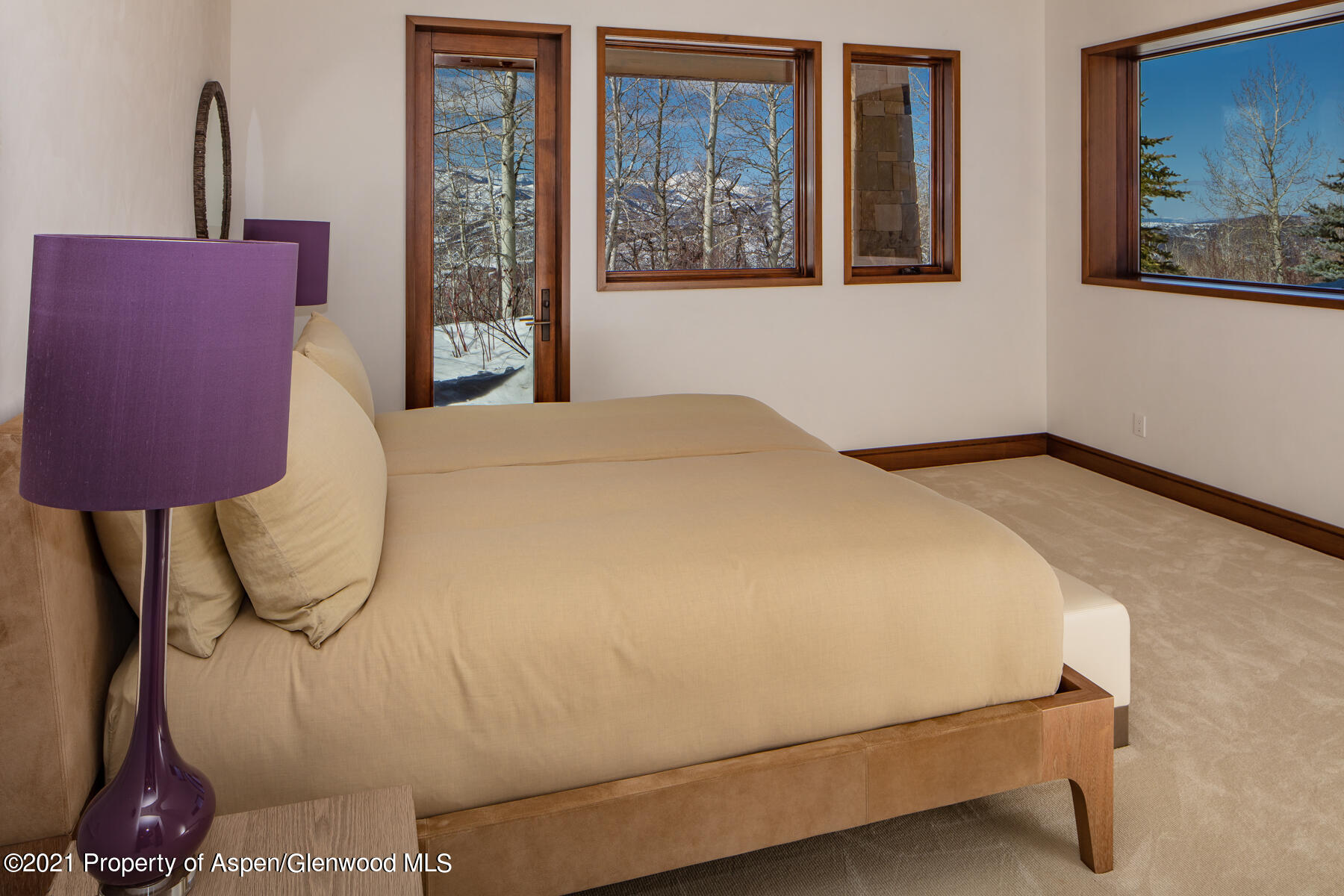 70 Larson Road Aspen, CO 81612 - Photo 30 of 64 a bedroom with a bed and dresser with wooden floor