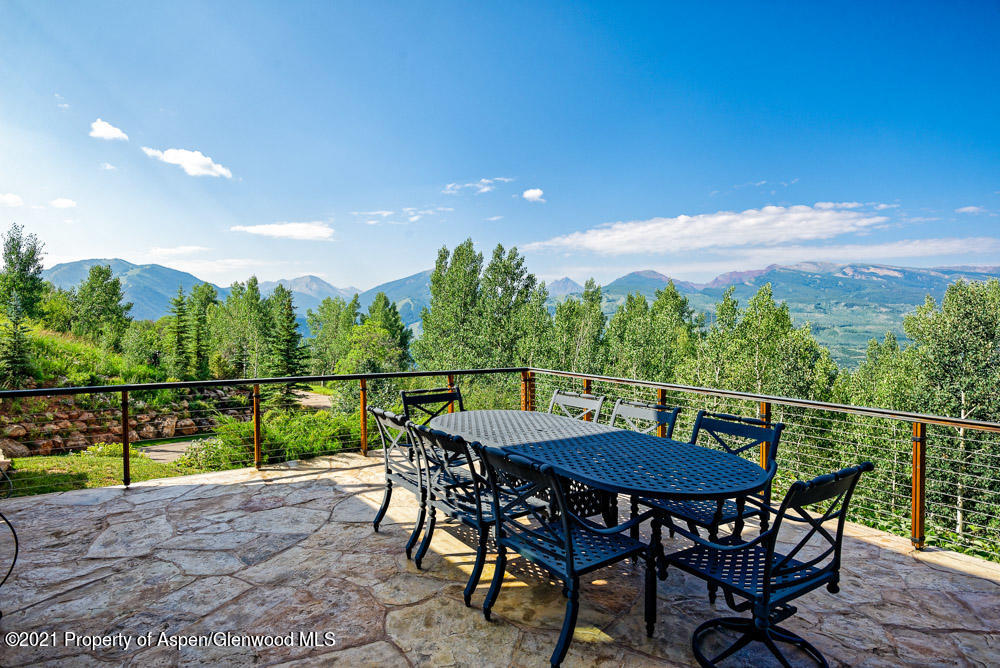 70 Larson Road Aspen, CO 81612 - Photo 35 of 64 a view of a chairs and table on the terrace
