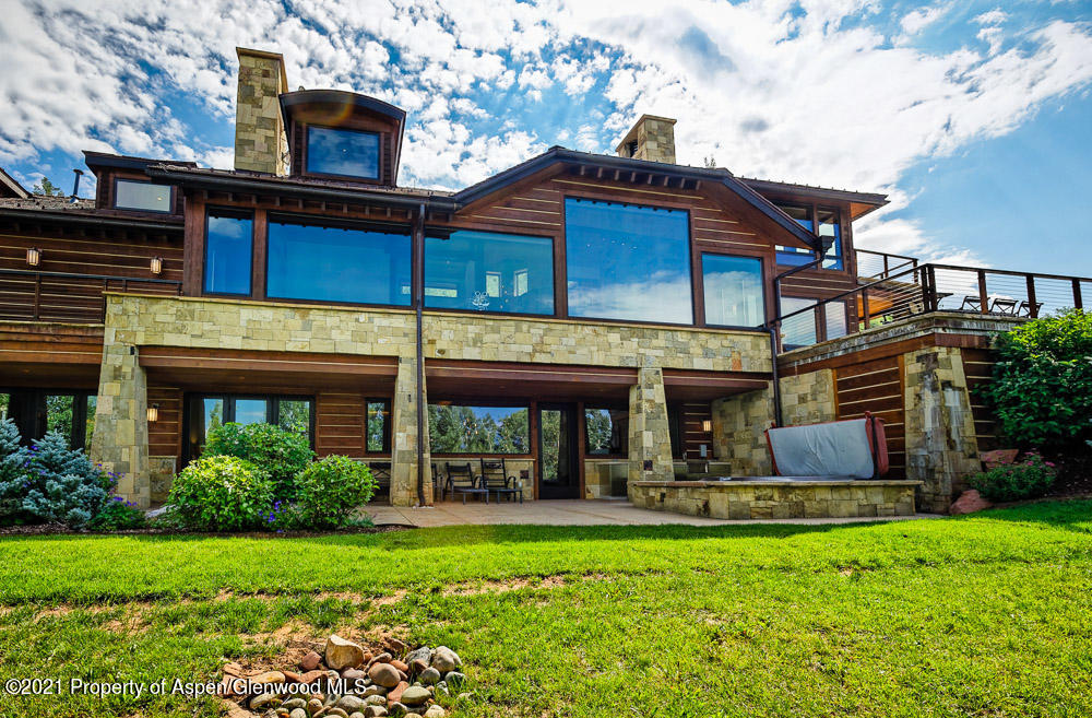 70 Larson Road Aspen, CO 81612 - Photo 42 of 64 a front view of a house with garden
