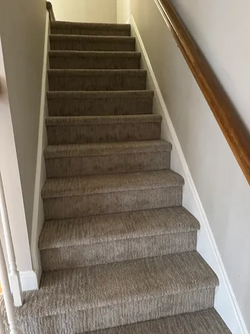 a bathroom with a bathtub and a window