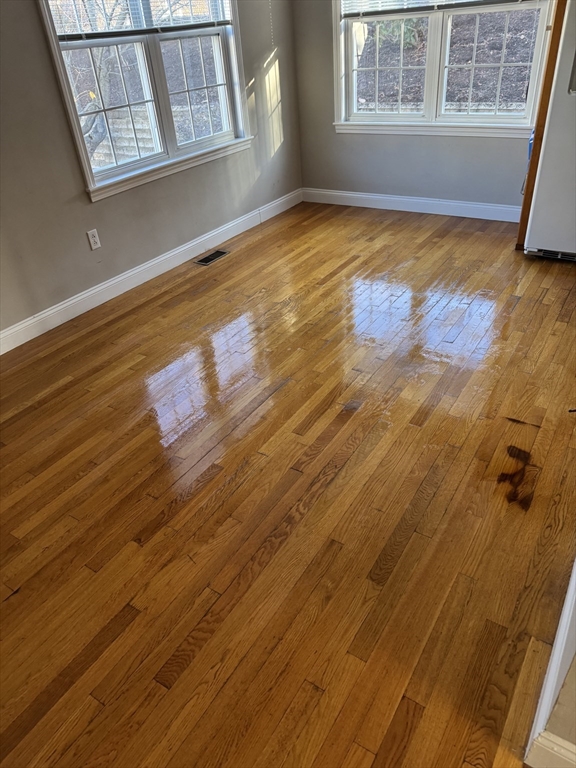 67 North Quinsigamond Avenue, Unit 9 Shrewsbury, MA 01545 - Photo 6 of 14 a view of empty room with window and wooden floor