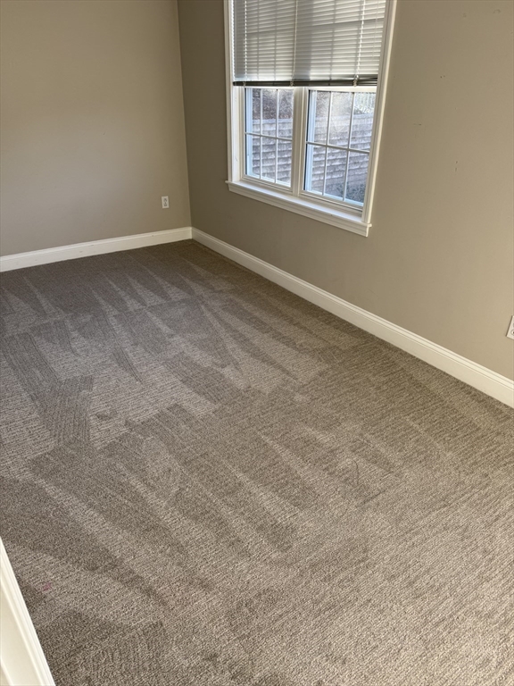 67 North Quinsigamond Avenue, Unit 9 Shrewsbury, MA 01545 - Photo 8 of 14 an empty room with windows