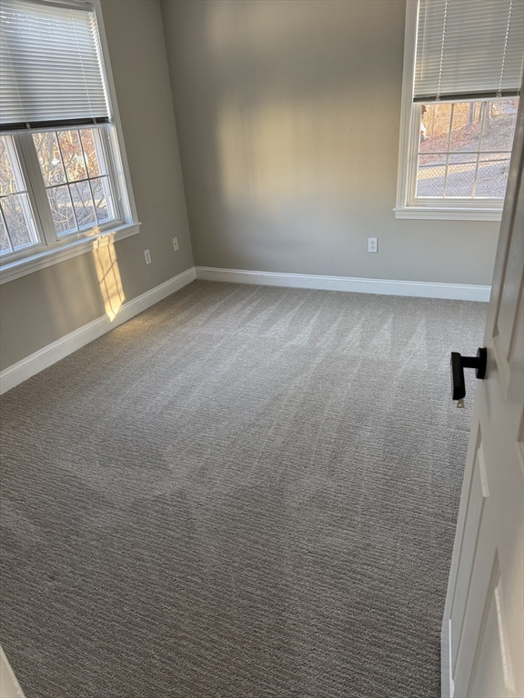 67 North Quinsigamond Avenue, Unit 9 Shrewsbury, MA 01545 - Photo 10 of 14 a view of an empty room with a window