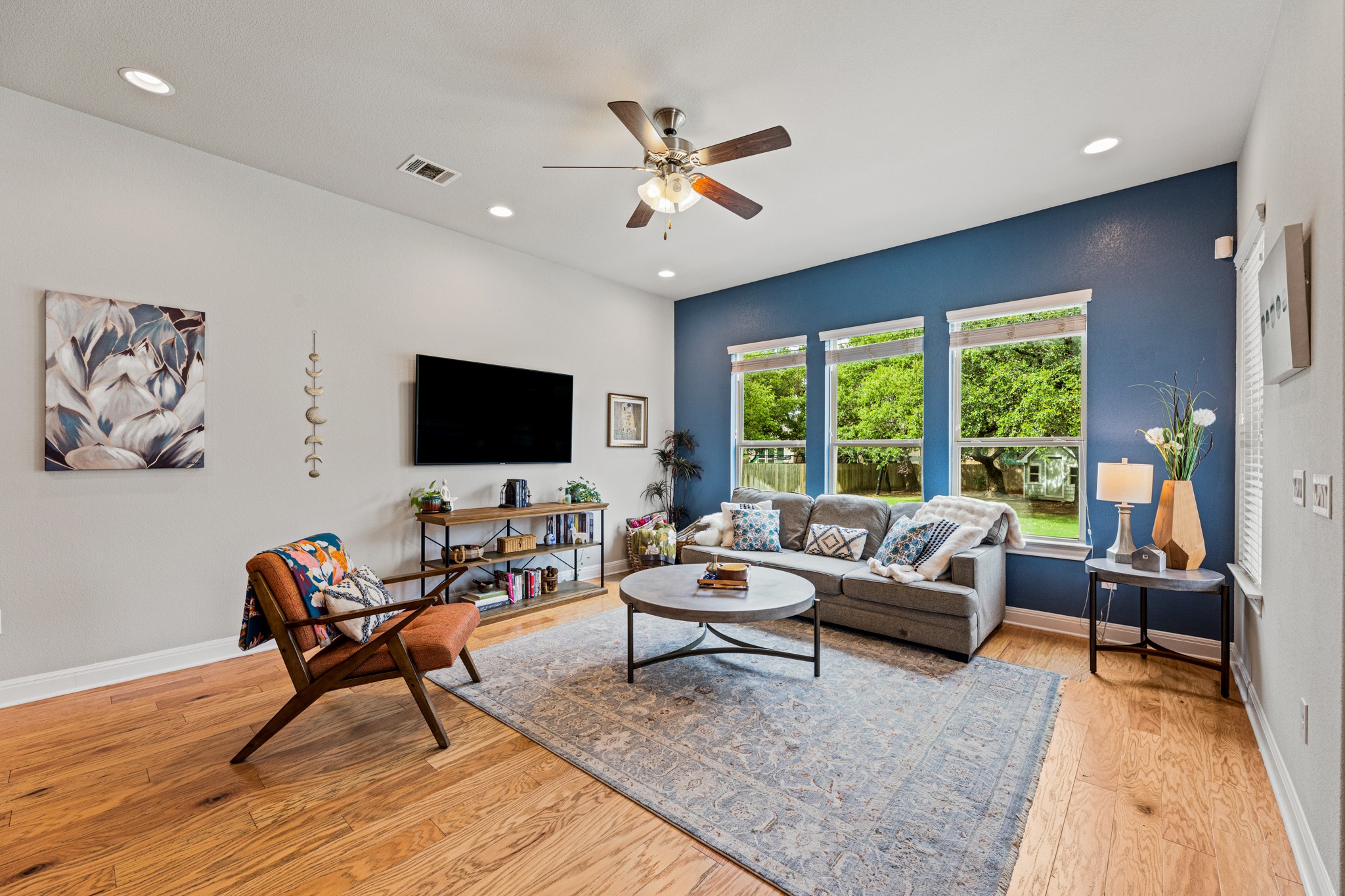 108 Redtail Lane Leander, TX 78641 - Photo 8 of 39 Hardwood floors and generous windows elevate this comfortable living space.