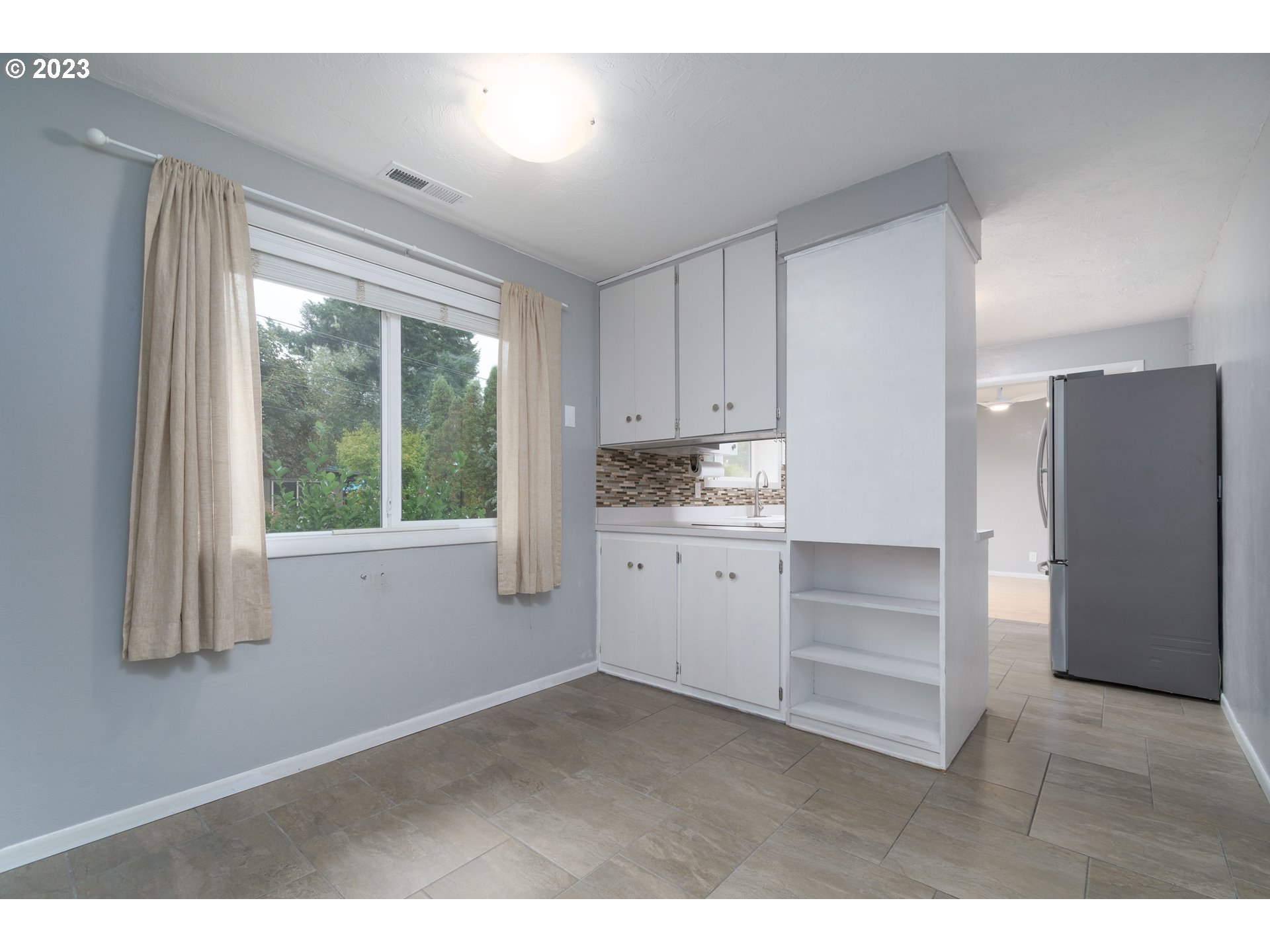 3950 Donald Street Eugene, OR 97405 - Photo 17 of 33 a kitchen with a refrigerator and window
