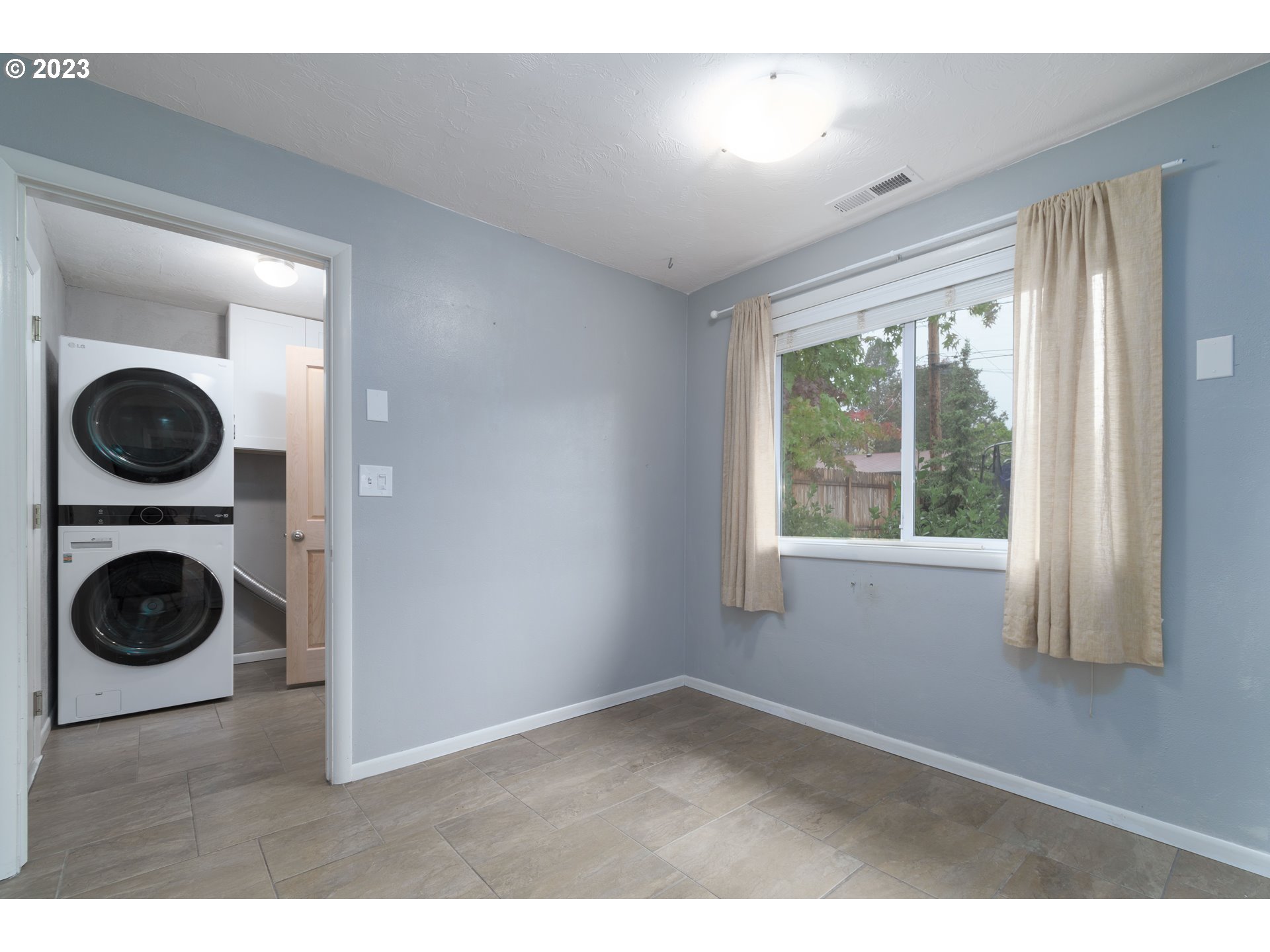 3950 Donald Street Eugene, OR 97405 - Photo 18 of 33 a view of a bedroom with washer and dryer