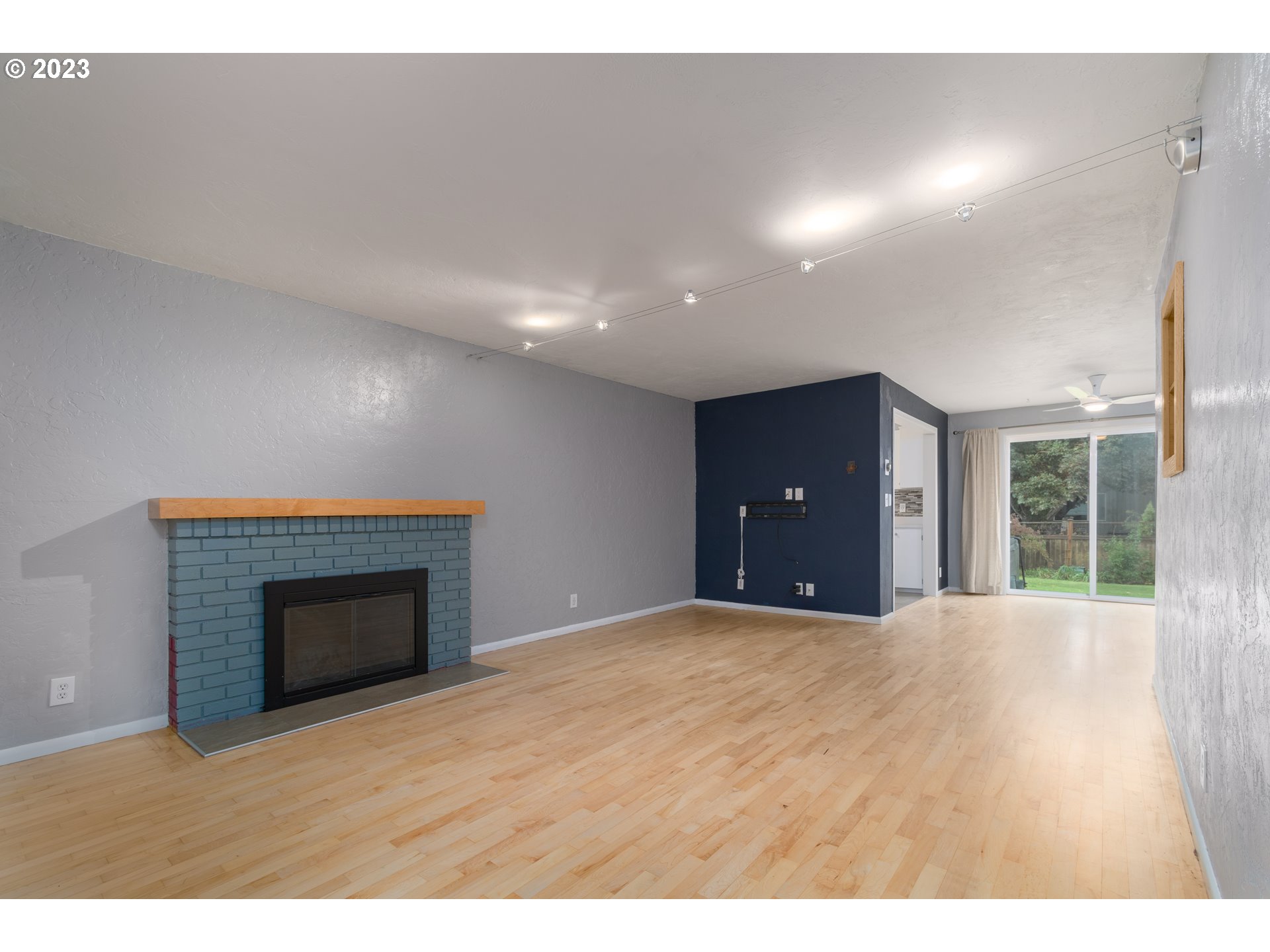 3950 Donald Street Eugene, OR 97405 - Photo 6 of 33 a view of an empty room with a fireplace