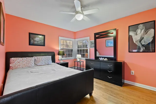 a bedroom with a bed and dresser