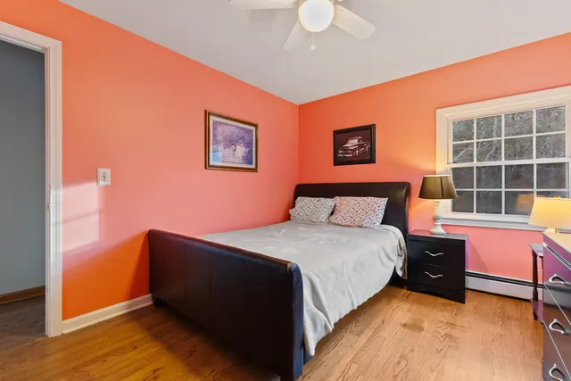 a bedroom with bed and window