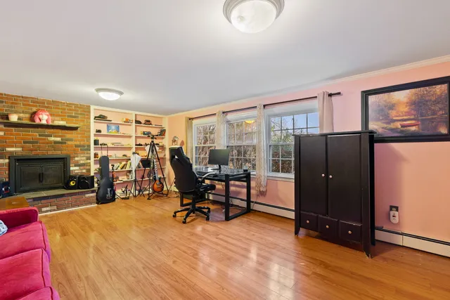 a view of a livingroom with furniture and a flat screen tv