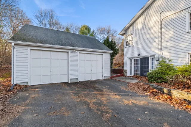 a view of a house with a yard and garage