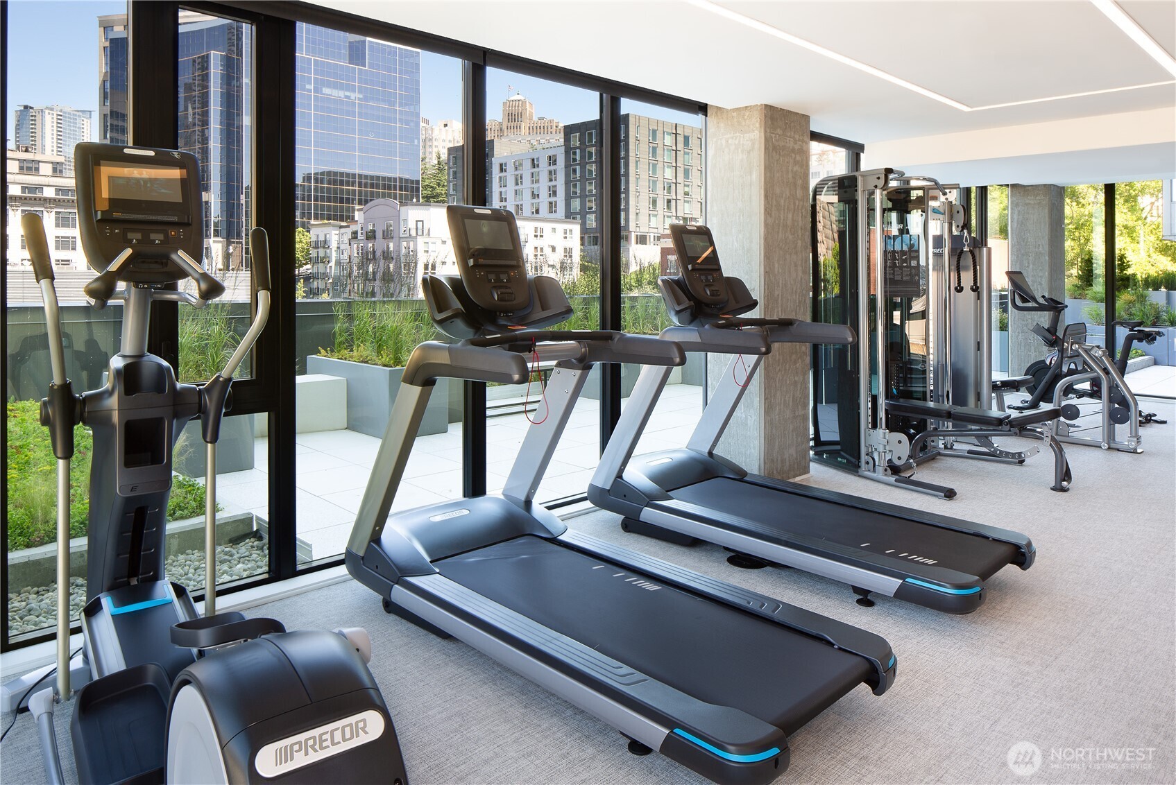 450 South Main Street, Unit 1102 Seattle, WA 98104 - Photo 21 of 26 a room with gym equipment and a large window