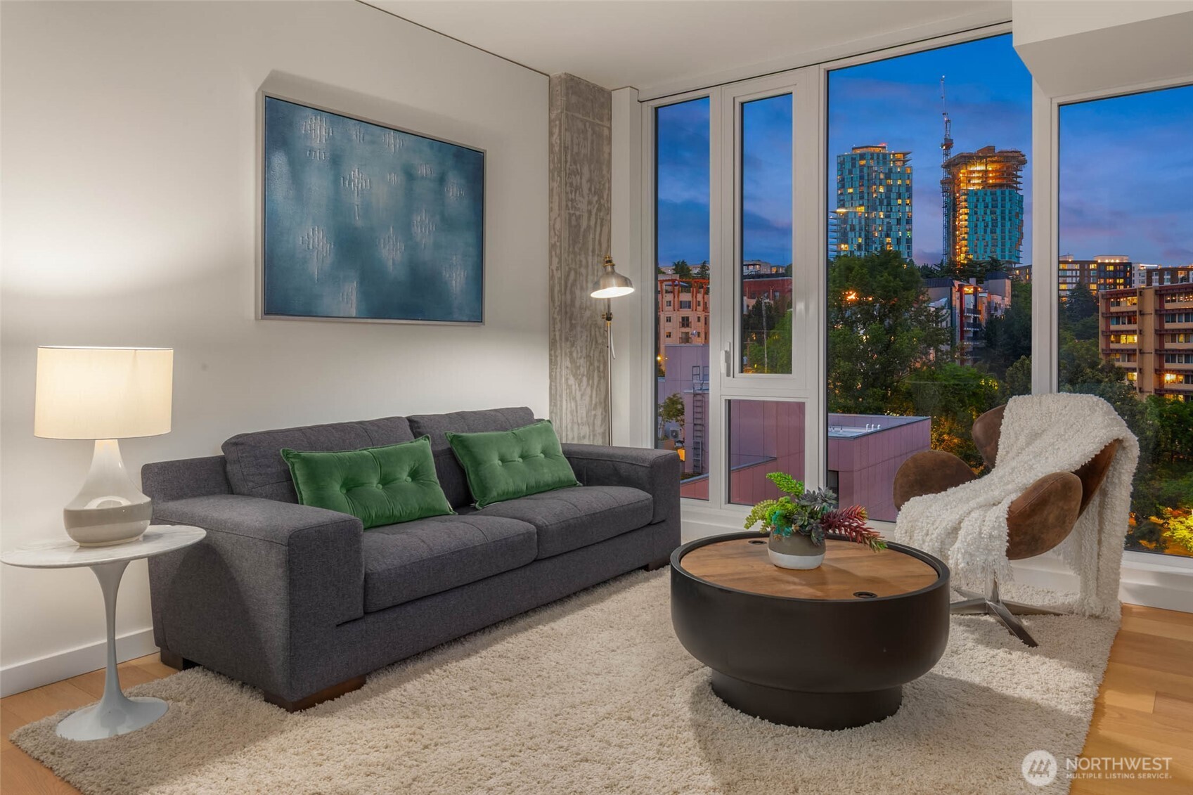 450 South Main Street, Unit 1102 Seattle, WA 98104 - Photo 4 of 26 a living room with furniture and a potted plant
