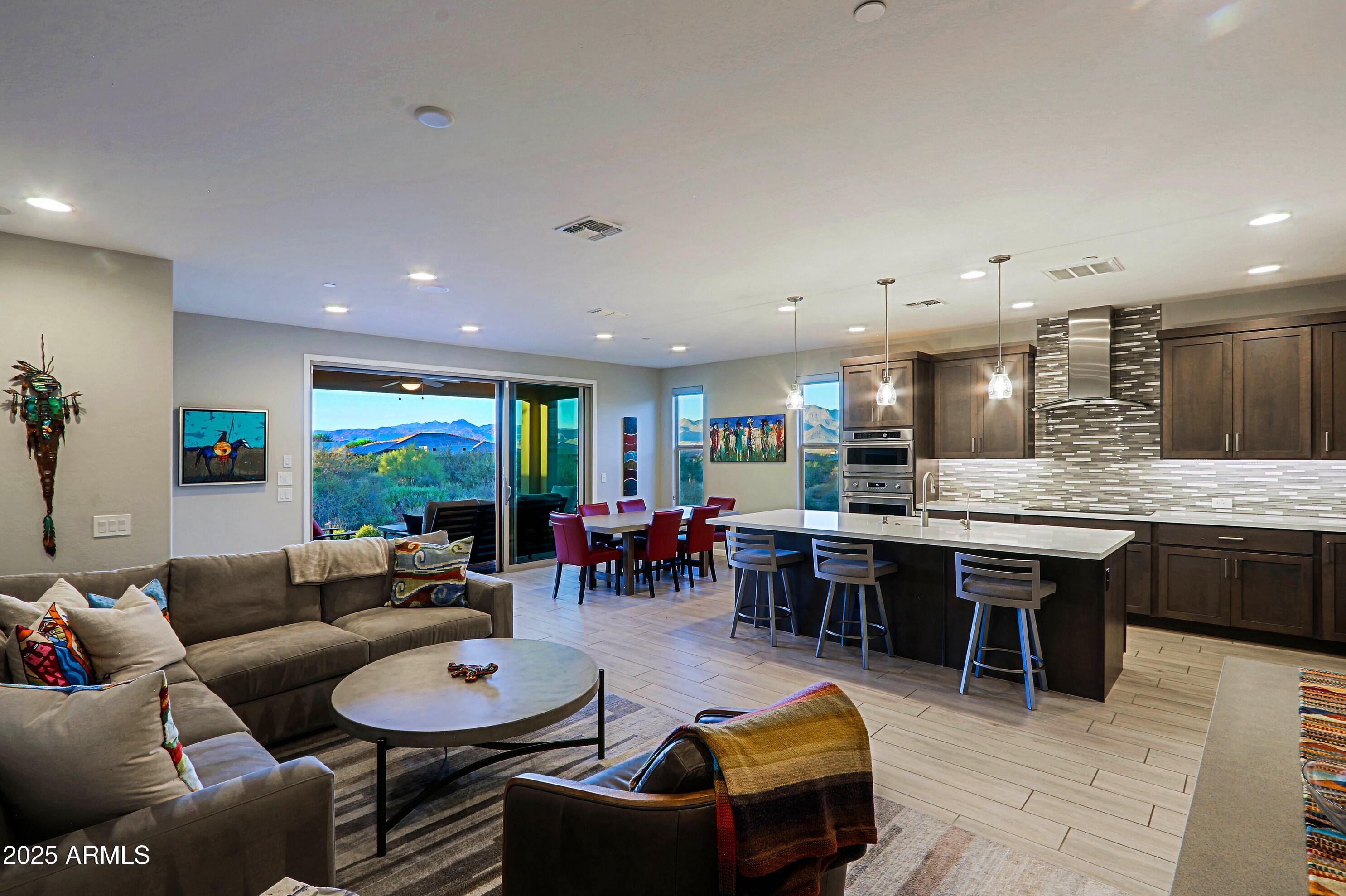 17668 East Chevelon Canyon Circle Rio Verde, AZ 85263 - Photo 11 of 59 a living room with lots of furniture a kitchen view and kitchen view