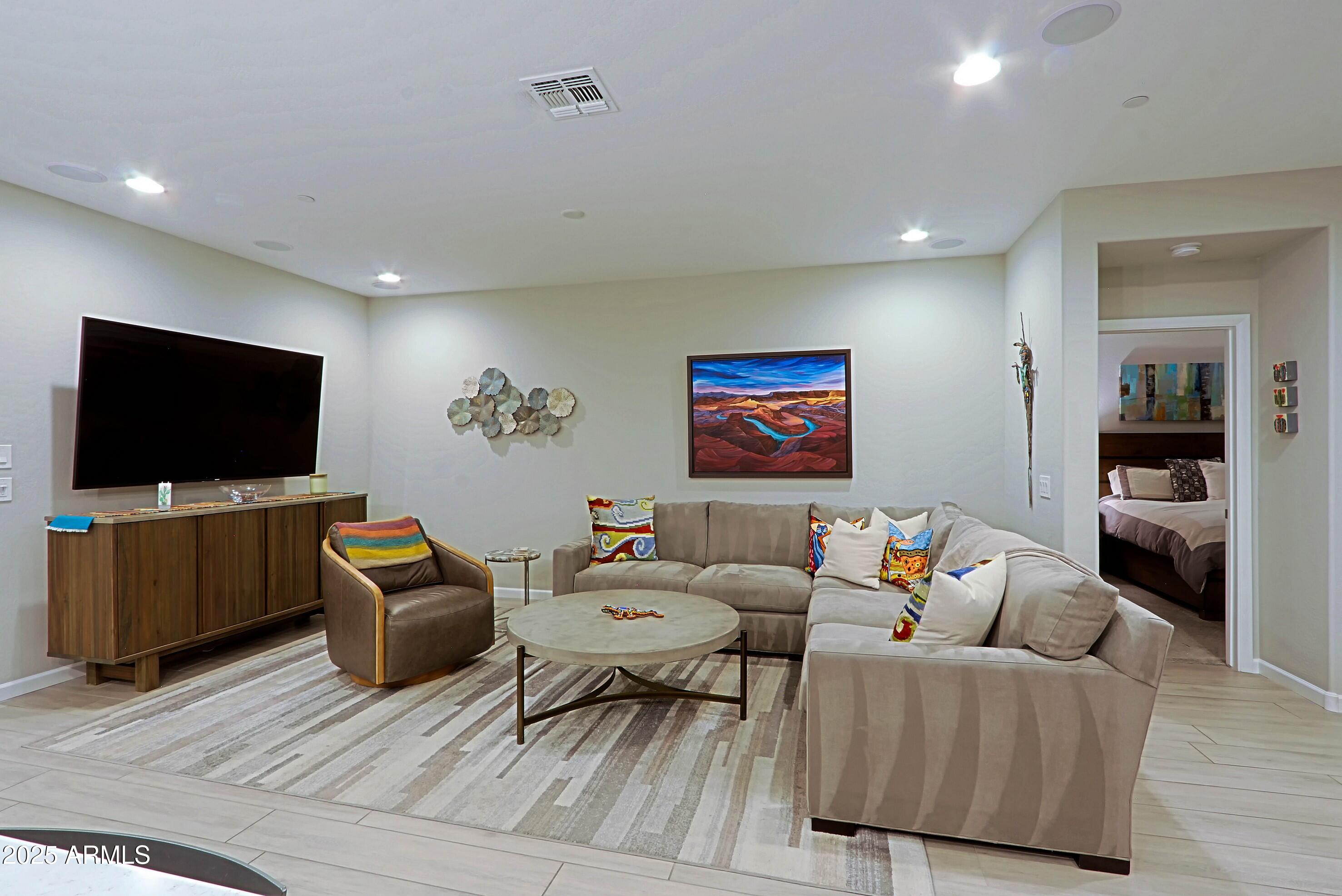 17668 East Chevelon Canyon Circle Rio Verde, AZ 85263 - Photo 13 of 59 a living room with furniture and a flat screen tv