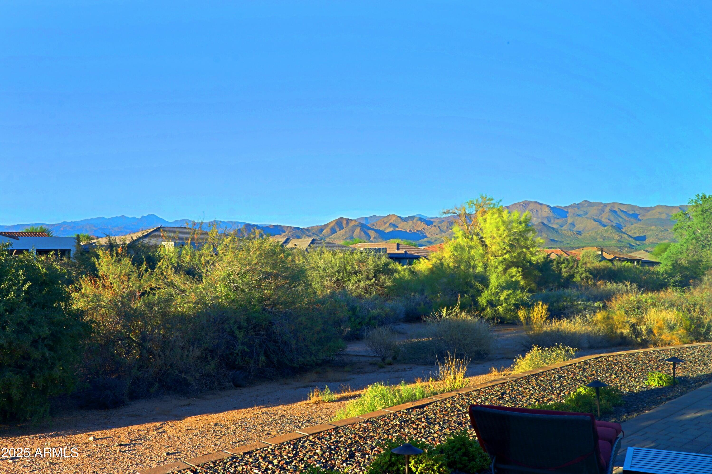 17668 East Chevelon Canyon Circle Rio Verde, AZ 85263 - Photo 24 of 59 a view of a lake with a mountain