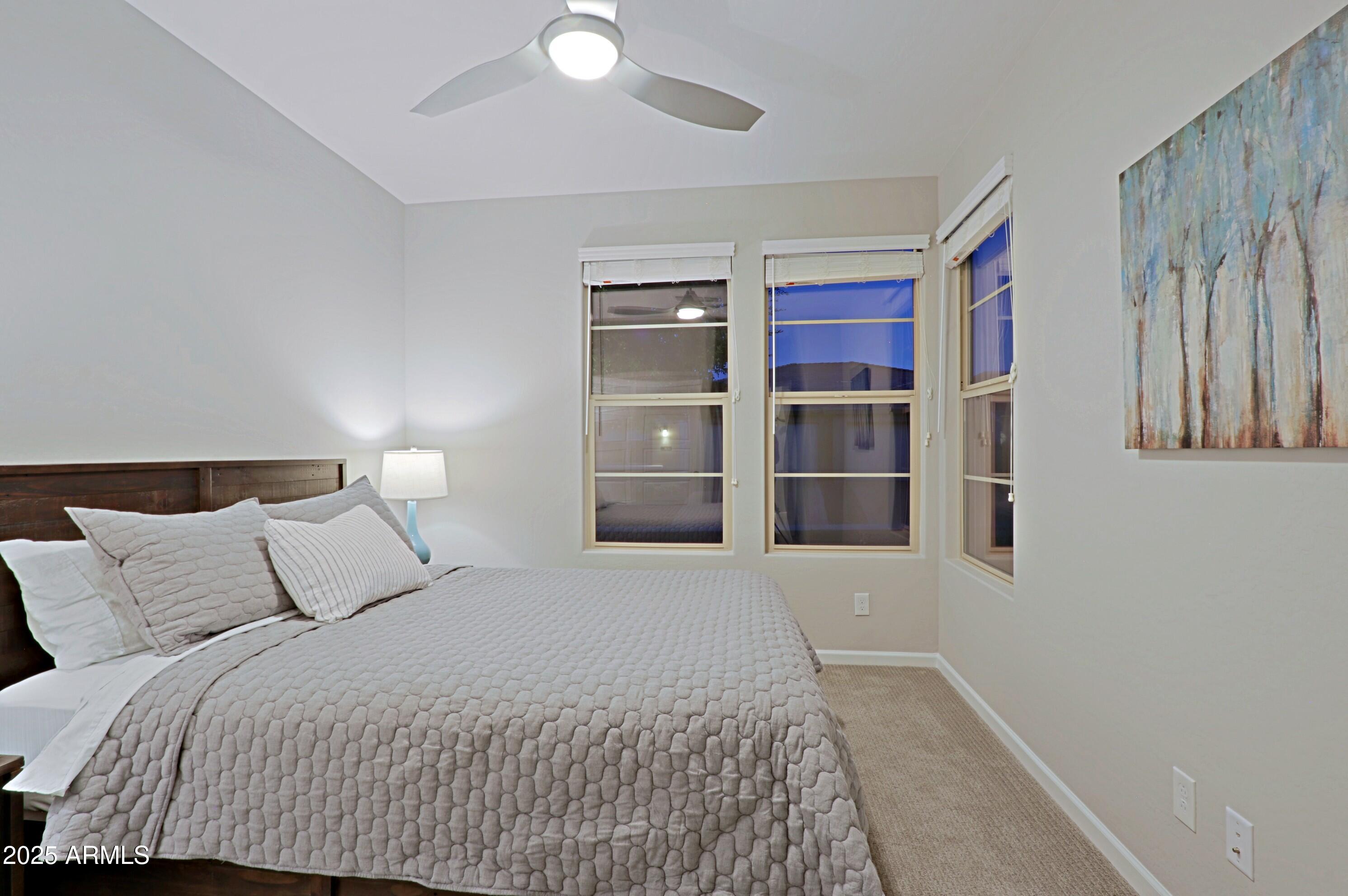 17668 East Chevelon Canyon Circle Rio Verde, AZ 85263 - Photo 28 of 59 a bedroom with a bed and cabinets