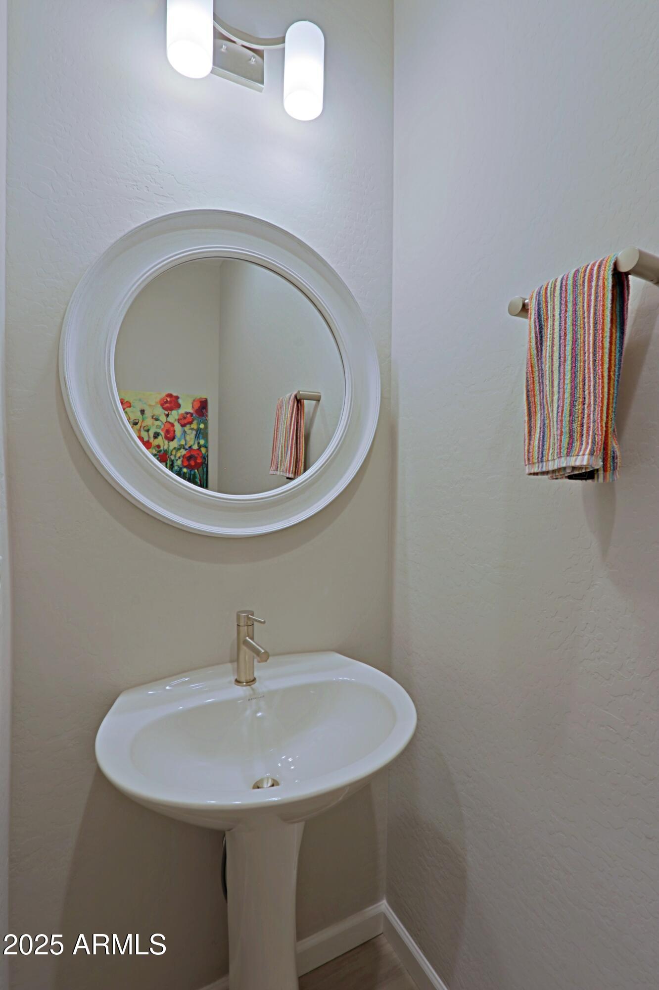 17668 East Chevelon Canyon Circle Rio Verde, AZ 85263 - Photo 33 of 59 a bathroom with a sink and mirror