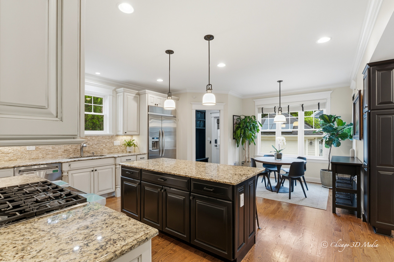 306 17th Street Wilmette, IL 60091 - Photo 13 of 48 a large kitchen with kitchen island a large island in the center