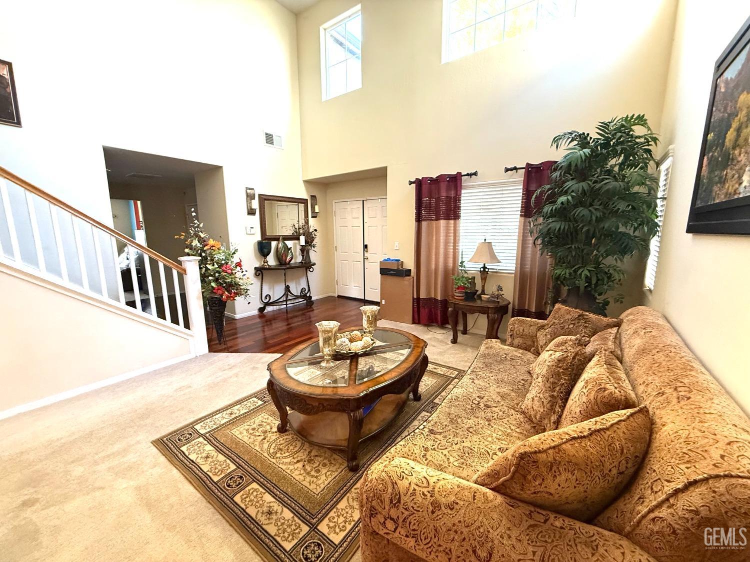 Undisclosed Address Bakersfield, CA 93311 - Photo 12 of 52 a living room with furniture and a potted plant